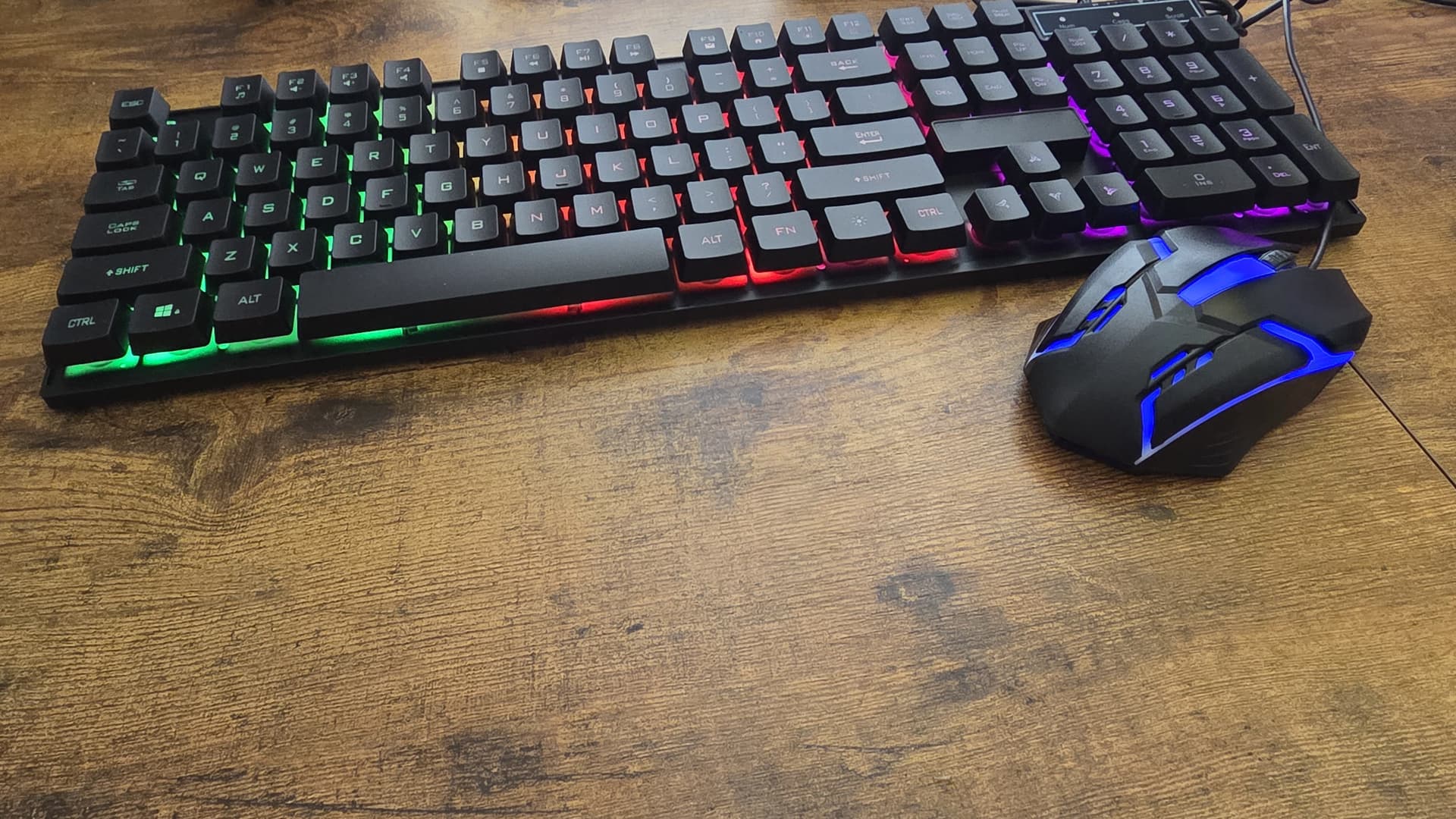 K323 RGB Keyboard & Mouse Combo on desk with RGB lighting